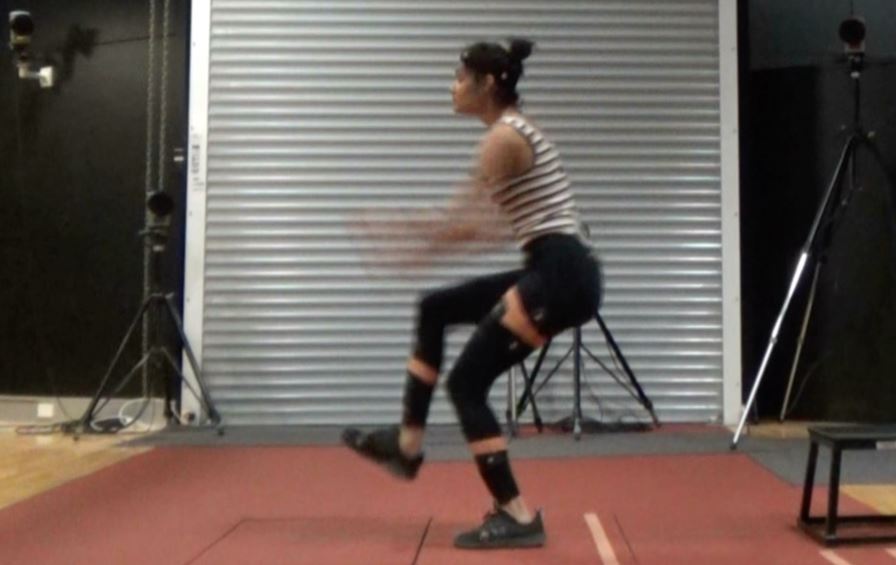 Athlete jumping, with cameras recording