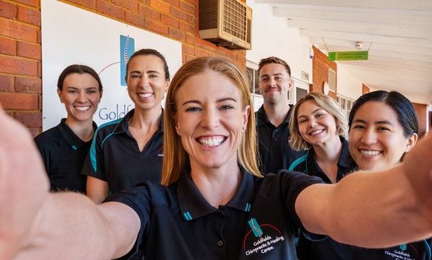 Cindy and team smiling