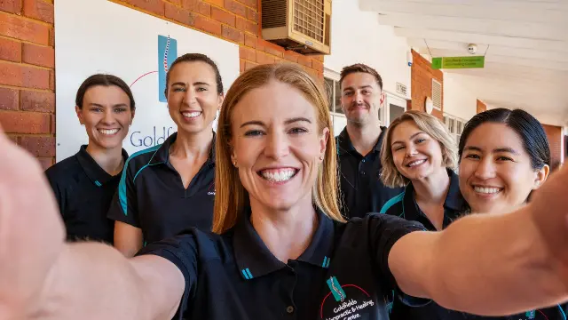 Cindy and team smiling