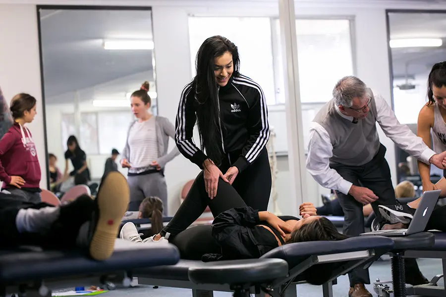 Class of students practicing stretching