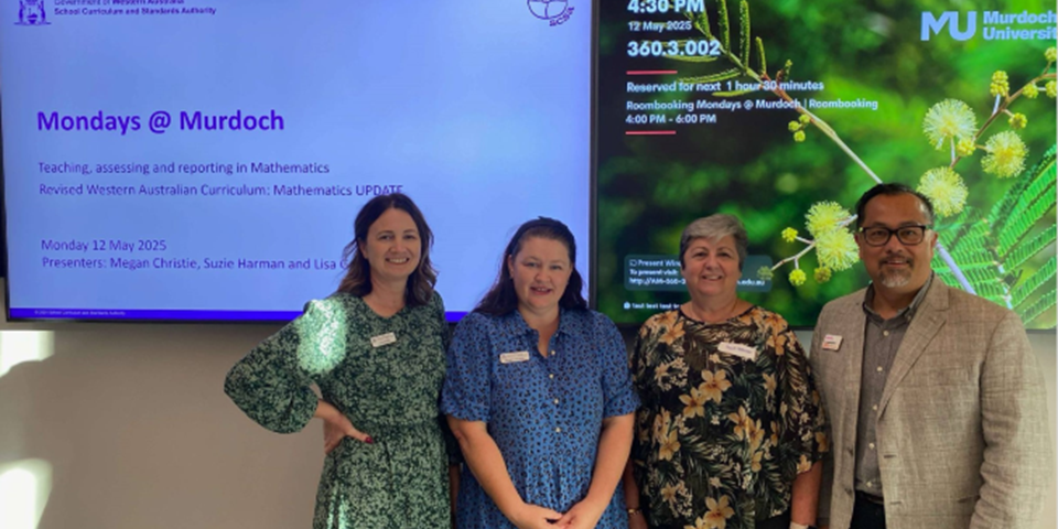 SCSA consultants and AD Engagement Dr Thomas Quinlinvan stand in front of the room