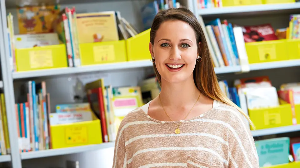 Female student smiling at camera