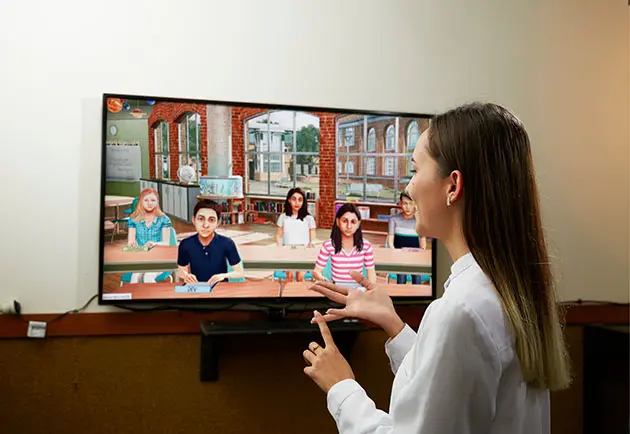 Student in front of screen with SIMLAB software