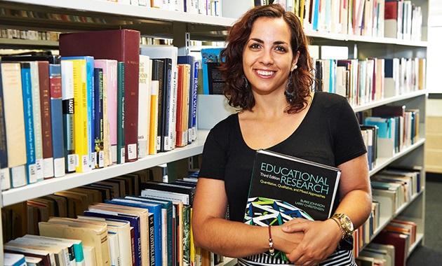 Woman with educational research book