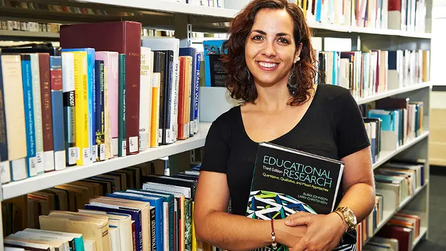 Woman with educational research book