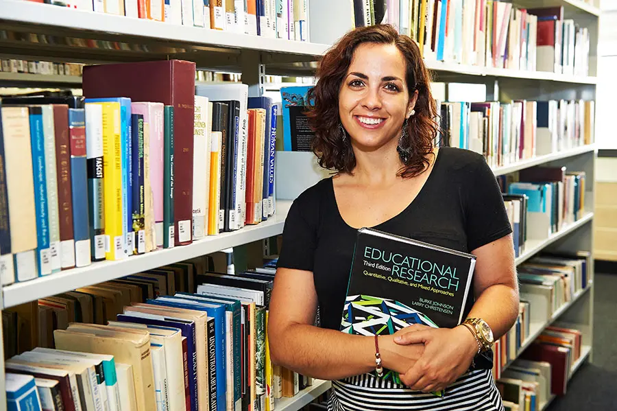Woman with educational research book