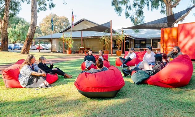 Commonwealth Prac Payments Group of people sitting on bean bags outside