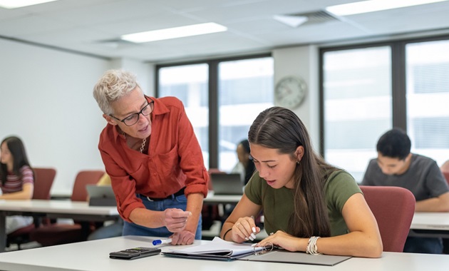 teacher helping student