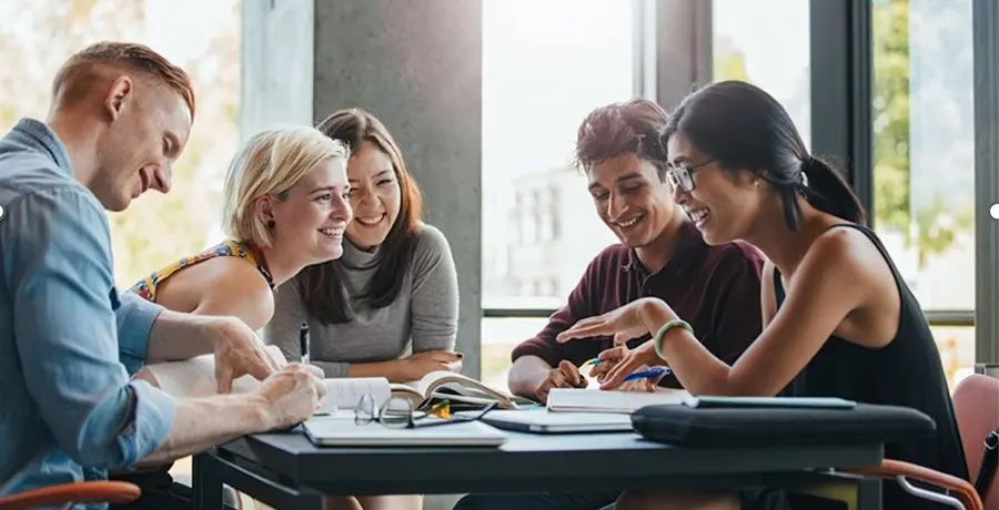 Students chatting around a table