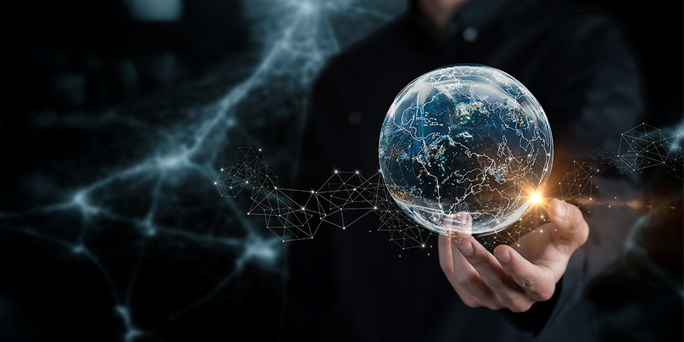 Hand holding world globe