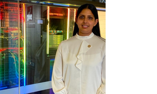 Teshani Kumarasinghe infront of data servers