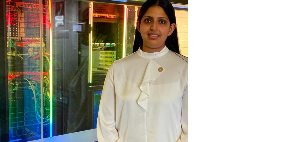 Teshani Kumarasinghe infront of data servers