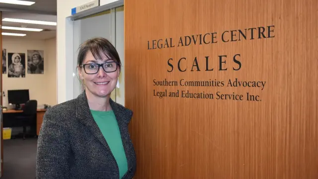 Anna Copeland in front of SCALES door