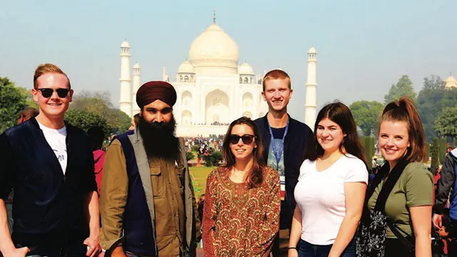 Law students posing in front of the Taj Mahal