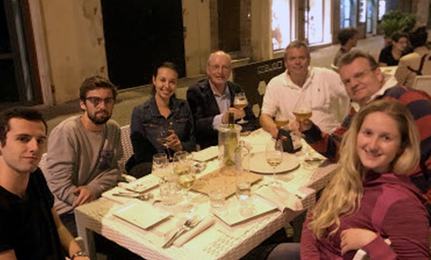 Students having outdoor dinner in Italy