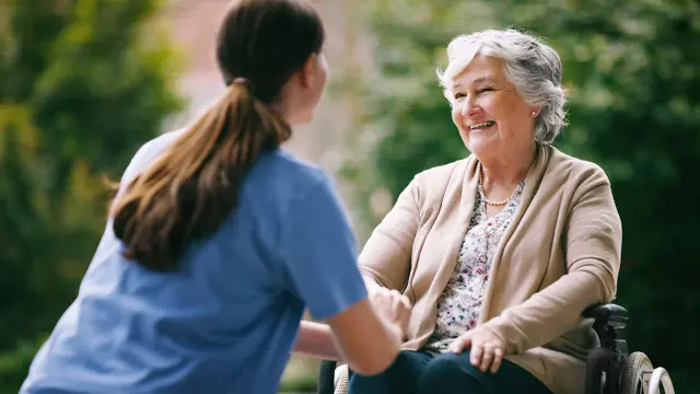 Nurse supporting woman