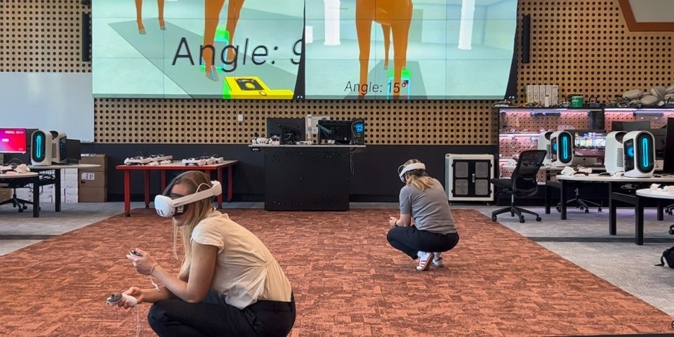 Two students wearing headsets for virtual learning