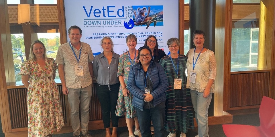 Group of people in front of VetEd sign
