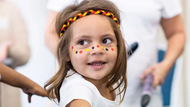 Young indigenous girl with traditional face paint